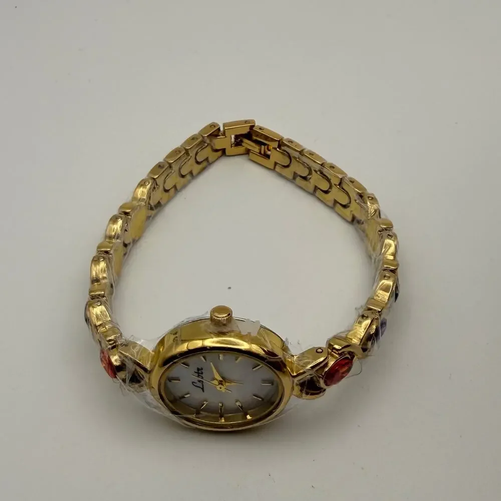 Elegant Gold-Tone Women's Bracelet Watch - Oval Dial & Gemstones New Battery